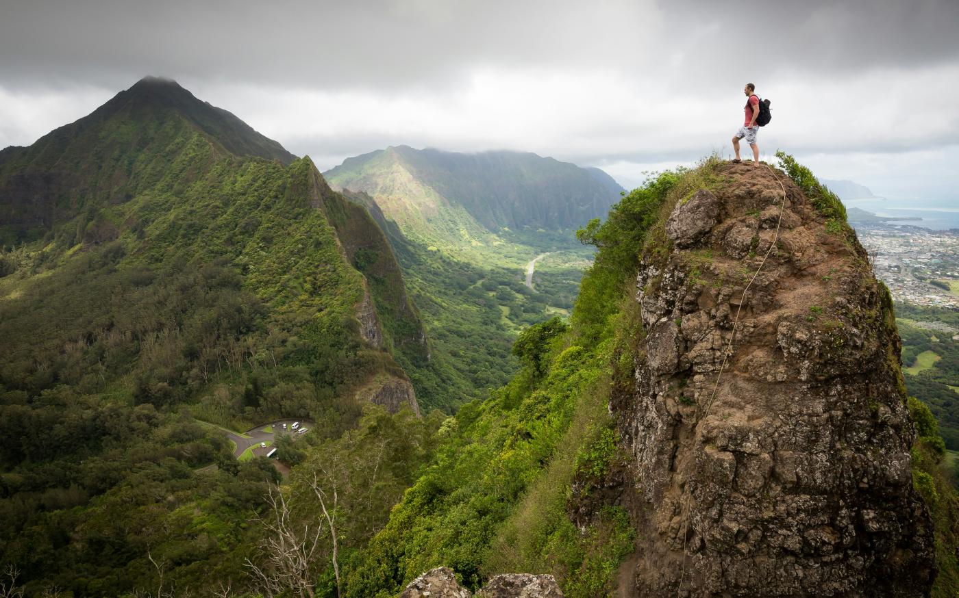 man on top of the mountain during daytime by Kalen Emsley courtesy of Unsplash.