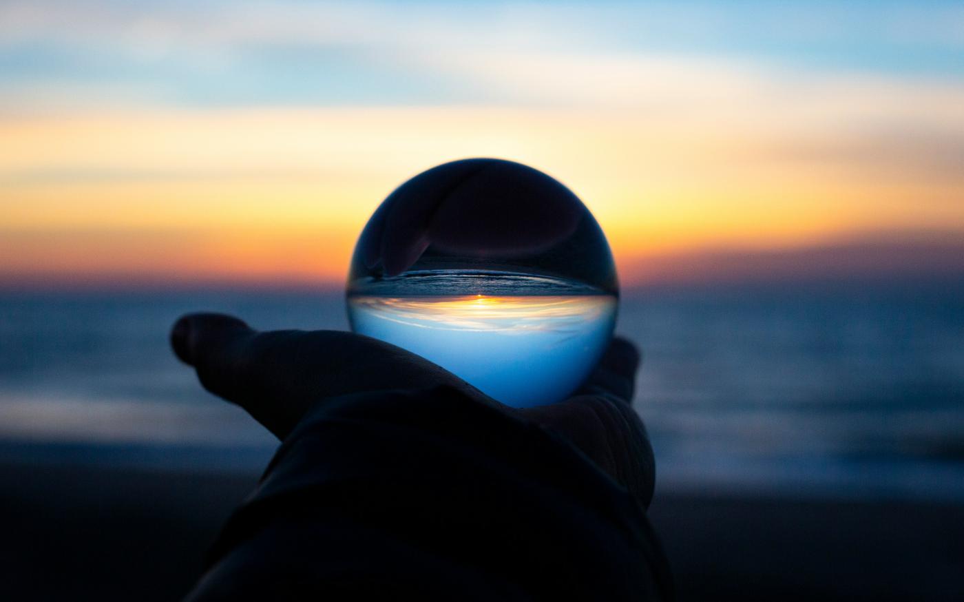 person holding clear glass glass by Drew Beamer courtesy of Unsplash.