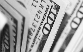 closeup photo of 100 US dollar banknotes by Pepi Stojanovski courtesy of Unsplash.