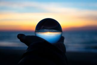 person holding clear glass glass by Drew Beamer courtesy of Unsplash.