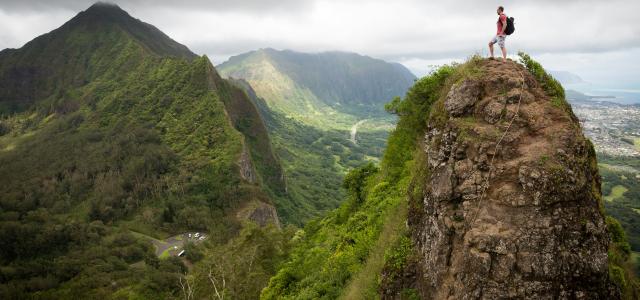 man on top of the mountain during daytime by Kalen Emsley courtesy of Unsplash.