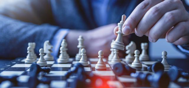depth of field photography of man playing chess by JESHOOTS.COM courtesy of Unsplash.