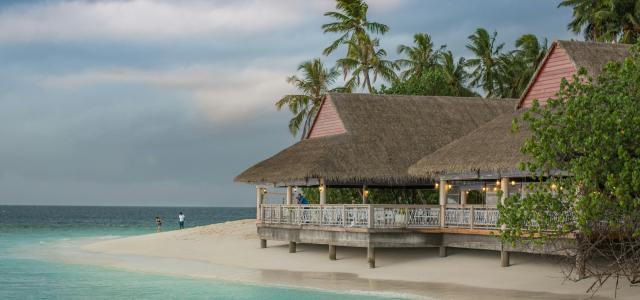brown hut near body of water by Mohd Elle courtesy of Unsplash.