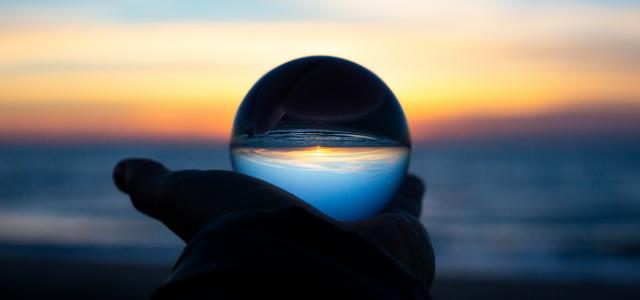 person holding clear glass glass by Drew Beamer courtesy of Unsplash.